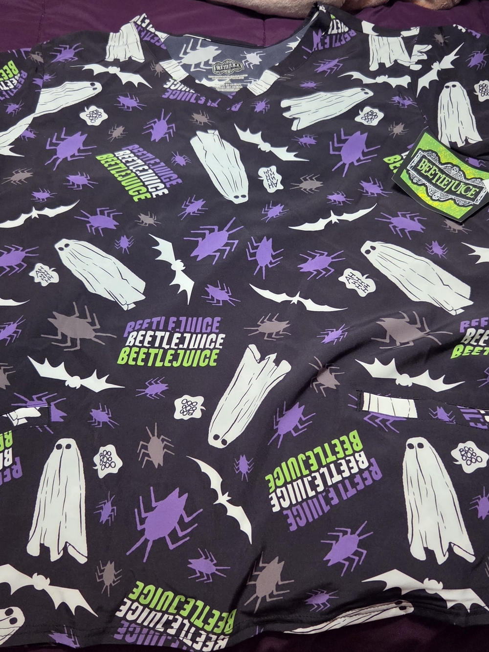 Beetlejuice Women’s Scrub Top- Black with Purple & White Ghost Print